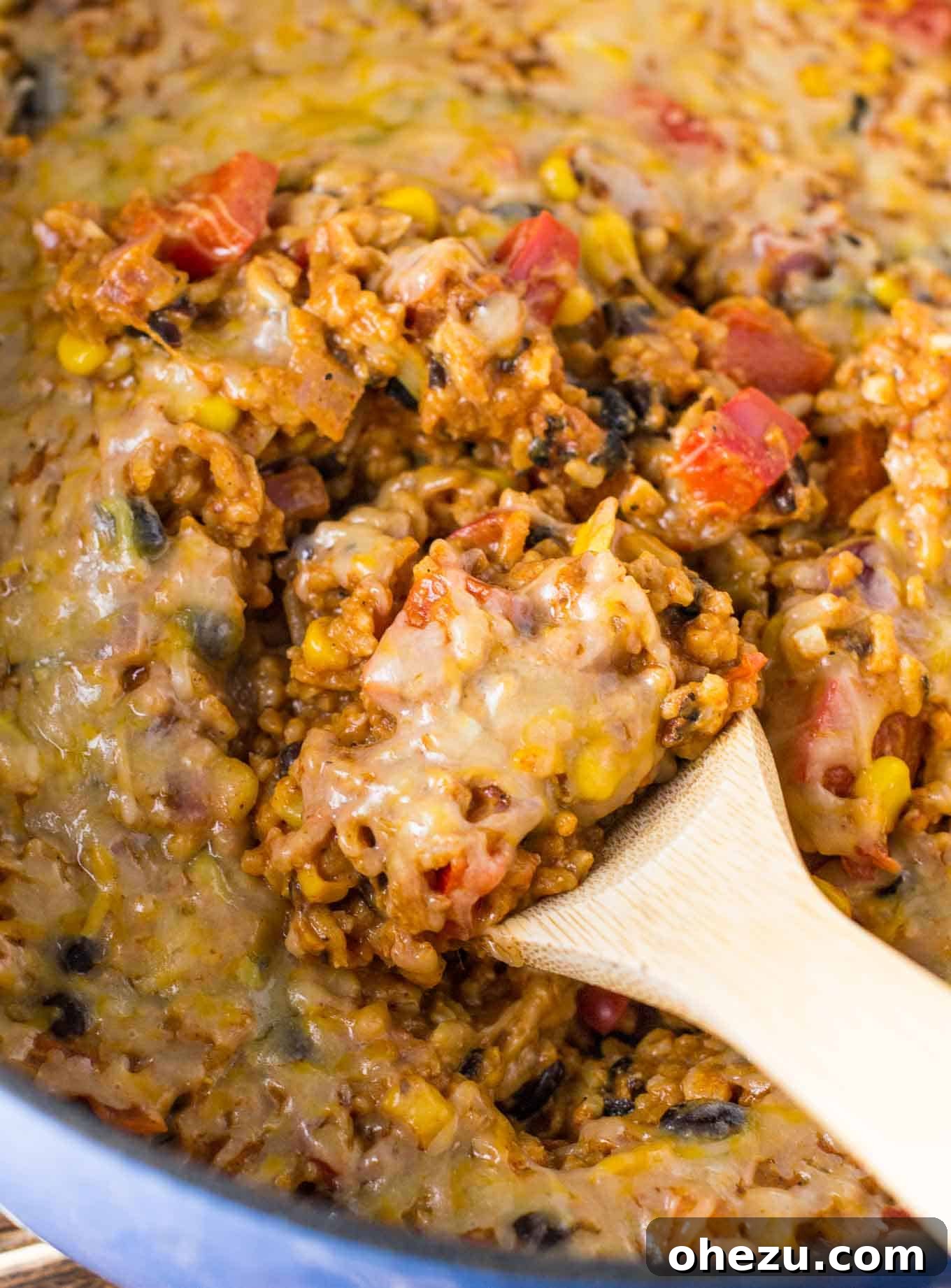 Fiesta Vegetarian Bake 4 Scoop of vegetarian Mexican casserole with a dollop of sour cream on top, ready to serve