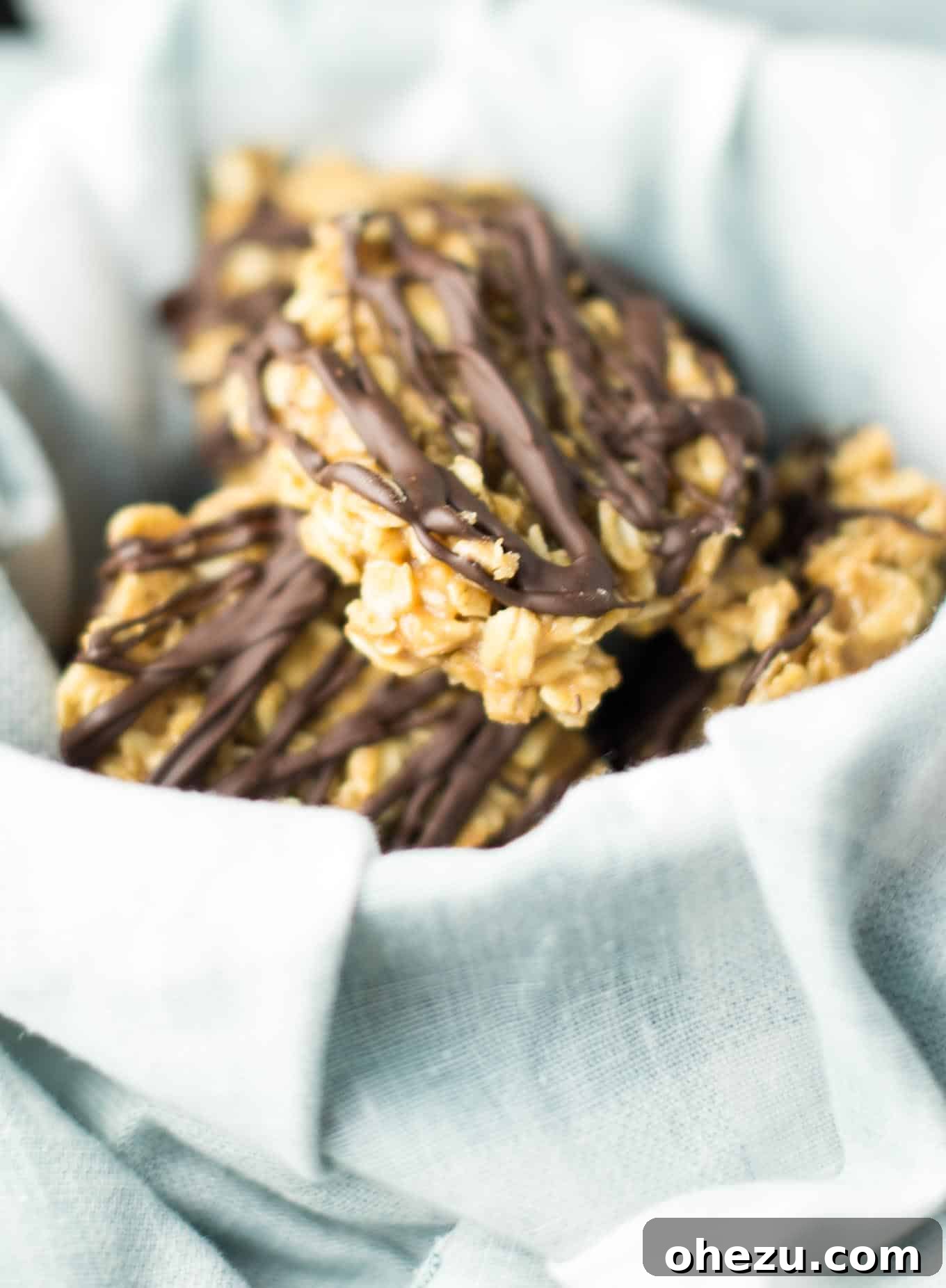Wholesome Peanut Butter No-Bake Treats 4 Close-up detailed shot of healthy peanut butter no bake cookies with a tempting chocolate drizzle, highlighting their rich texture