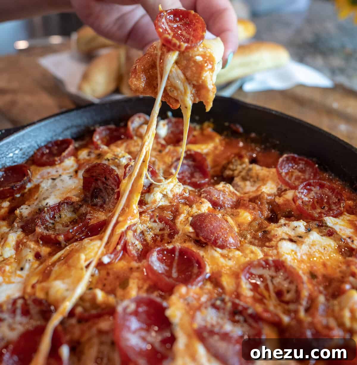 Loaded Meat Pizza Dip 6 Close-up of Fresh Basil Garnish on Meat Lover's Pizza Dip