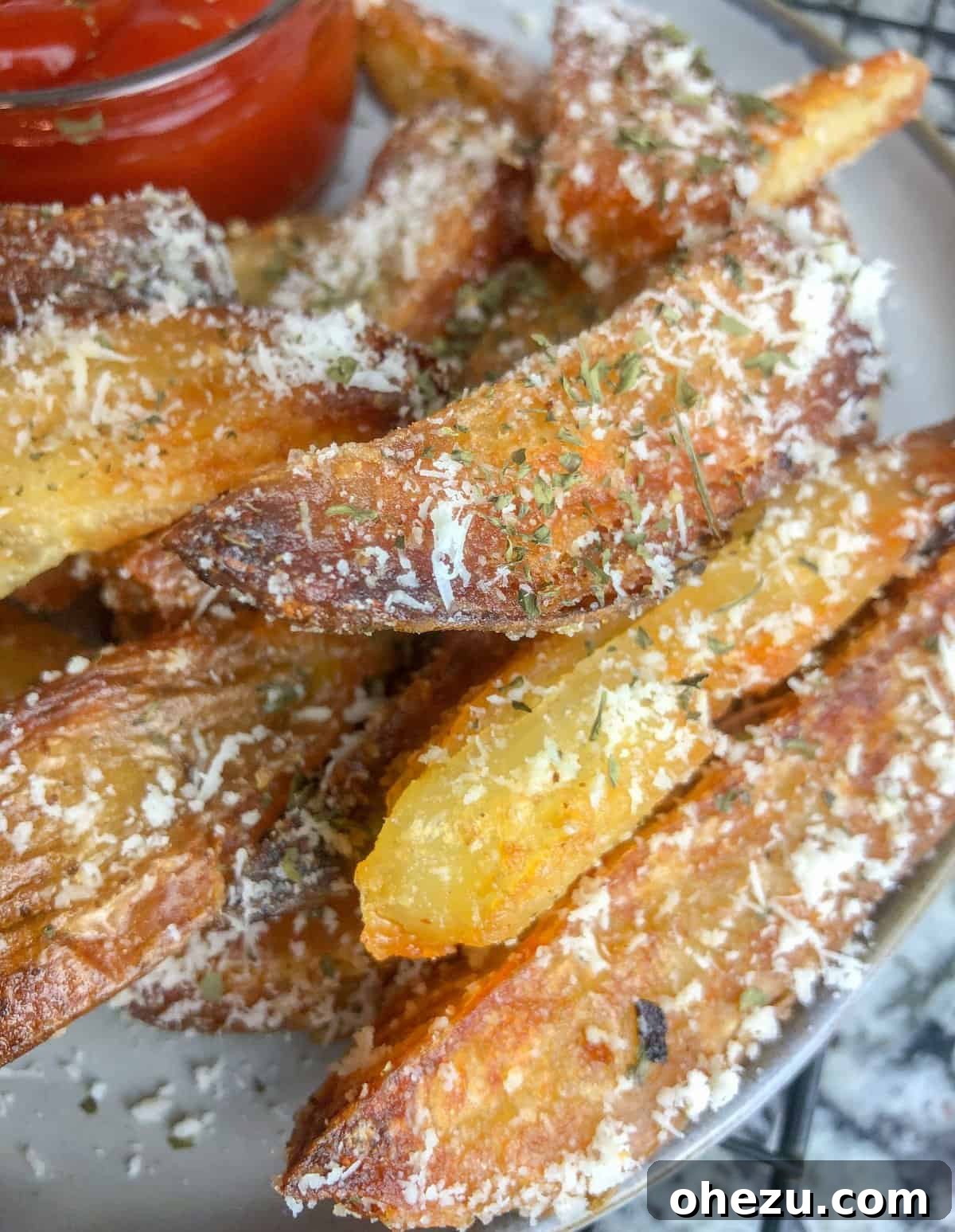 A close-up of crispy baked oven fries seasoned to perfection