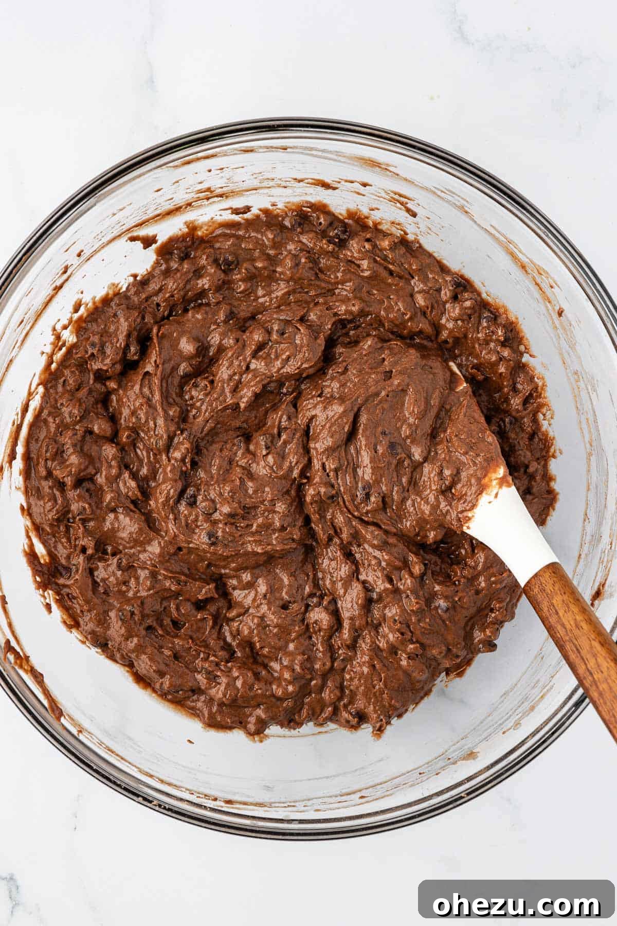 Nourishing Chocolate Mufflets 12 Chocolate muffin batter with mini chocolate chips uniformly folded in, ready for baking