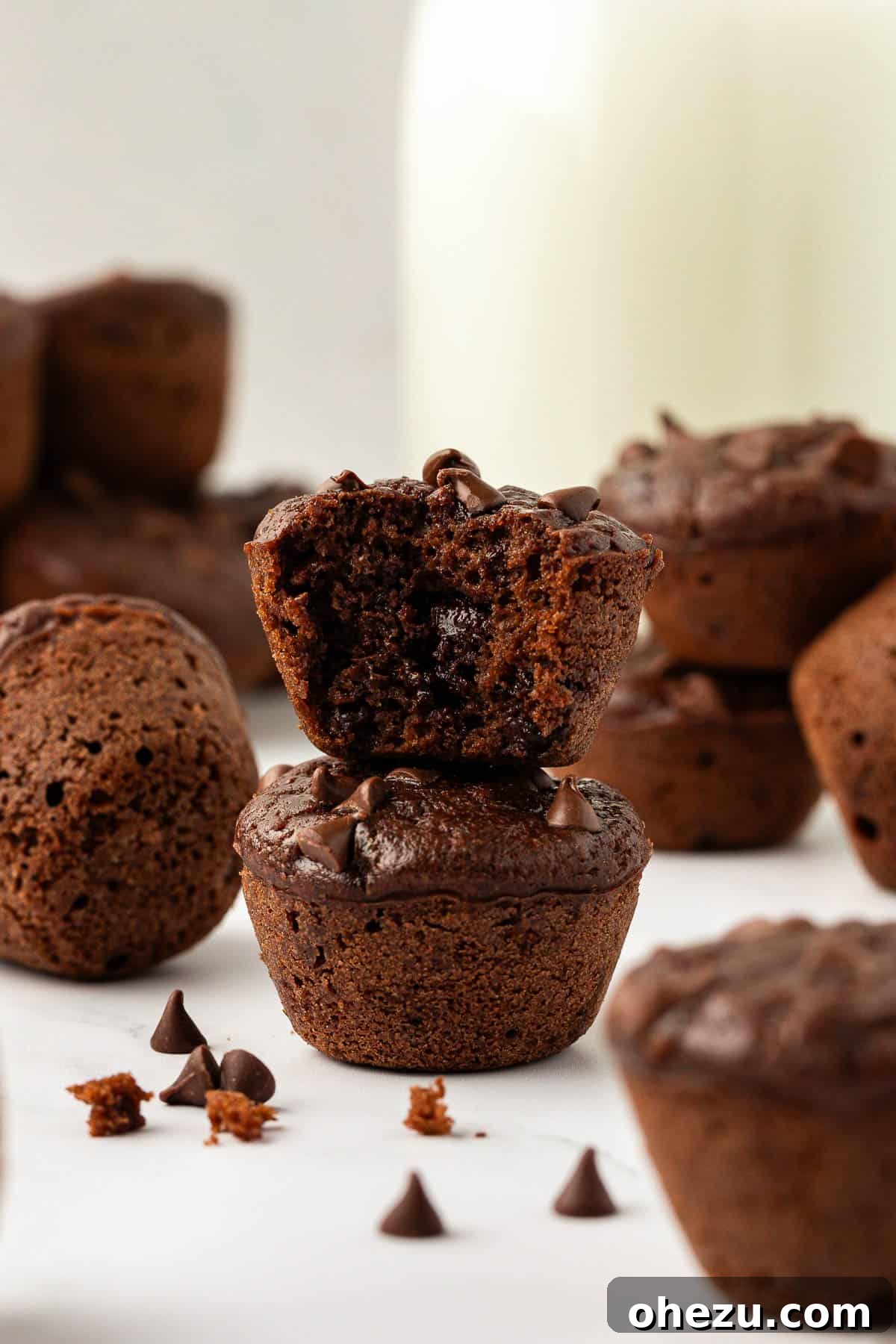 Nourishing Chocolate Mufflets 16 Stacked healthy chocolate mini muffins on a wooden board, showcasing their appealing presentation