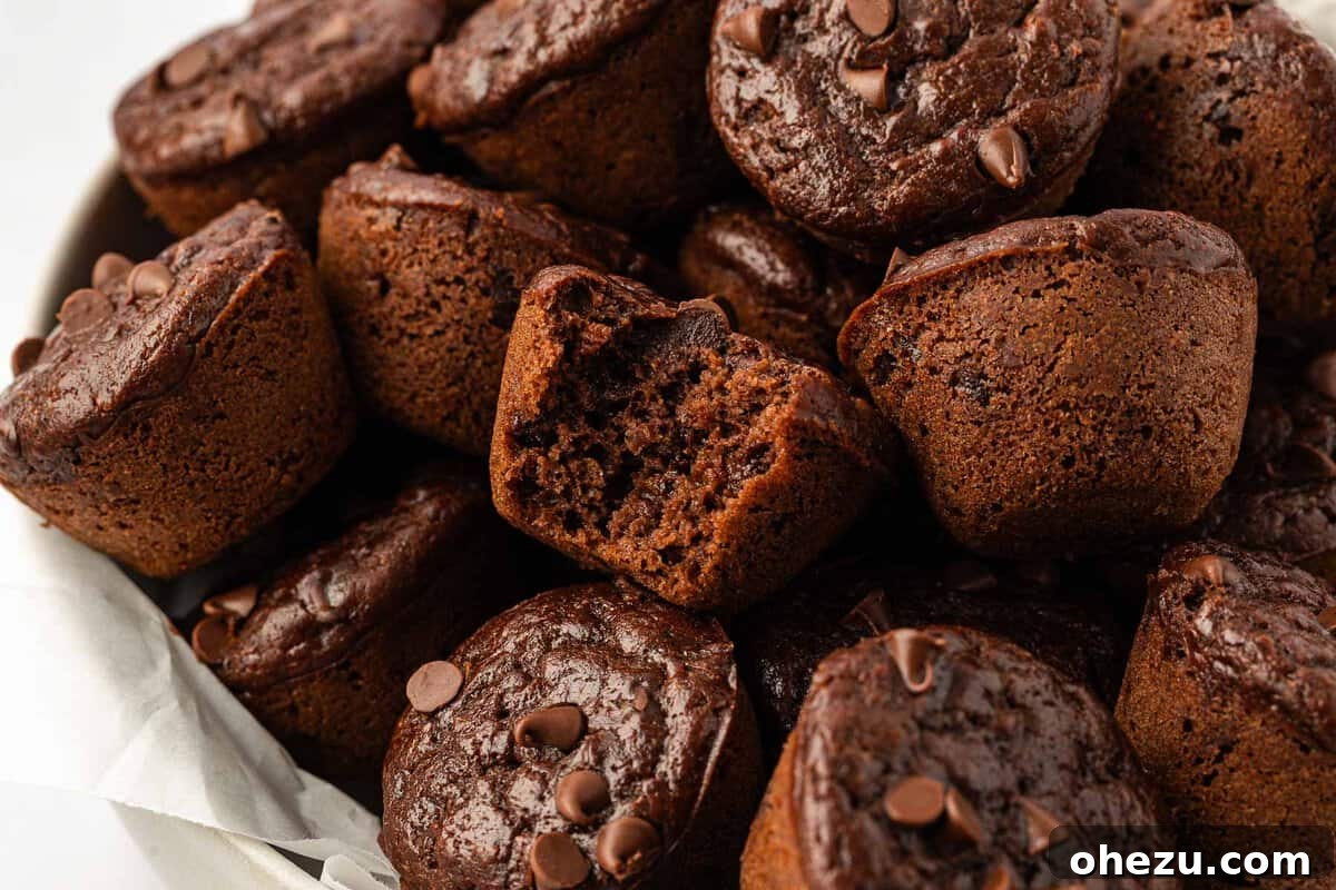 Nourishing Chocolate Mufflets 3 Close-up of baked healthy chocolate mini muffins, showcasing their rich chocolate color and mini size