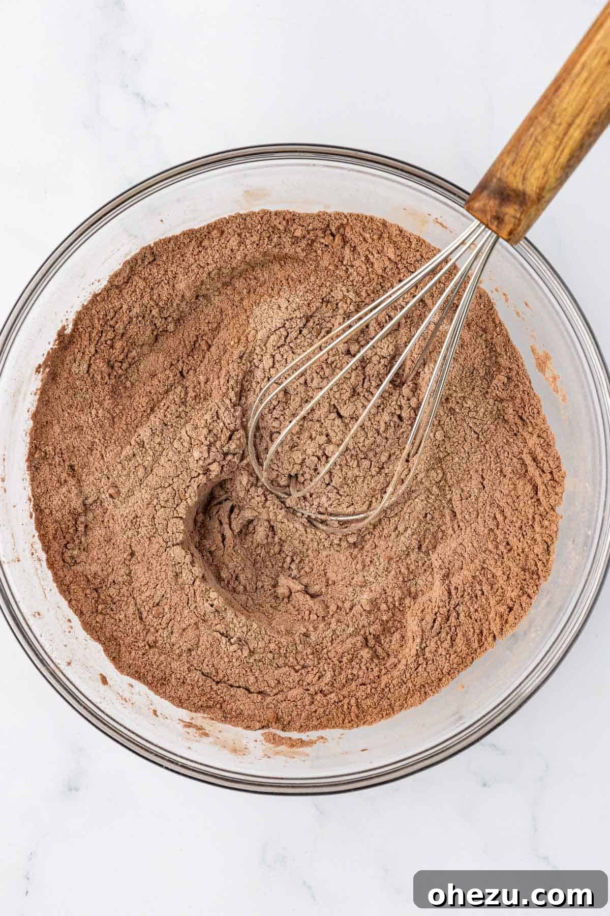 Nourishing Chocolate Mufflets 6 Whisked dry ingredients for chocolate mini muffins, showing a uniform brown mixture