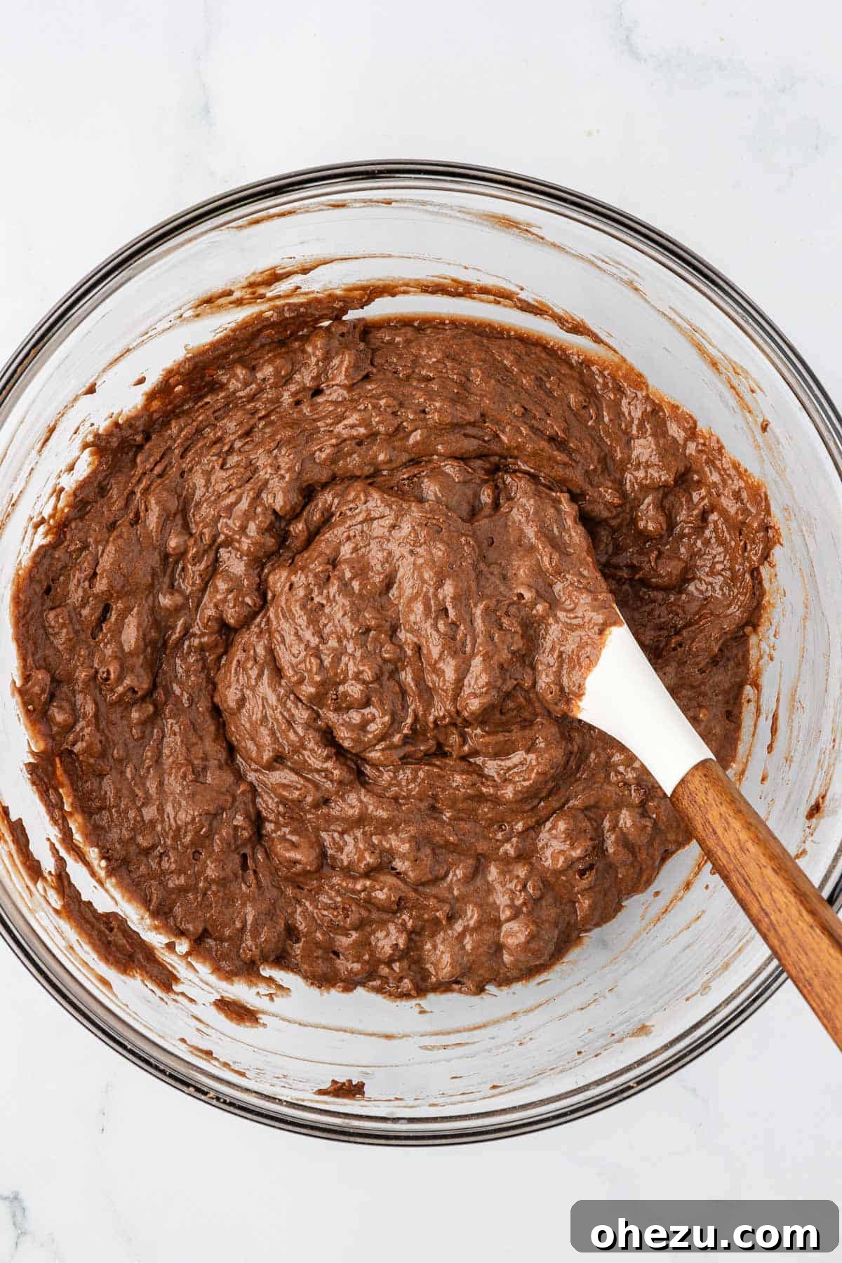 Nourishing Chocolate Mufflets 10 Healthy chocolate mini muffin batter in a bowl, showing its thick, slightly lumpy consistency after combining