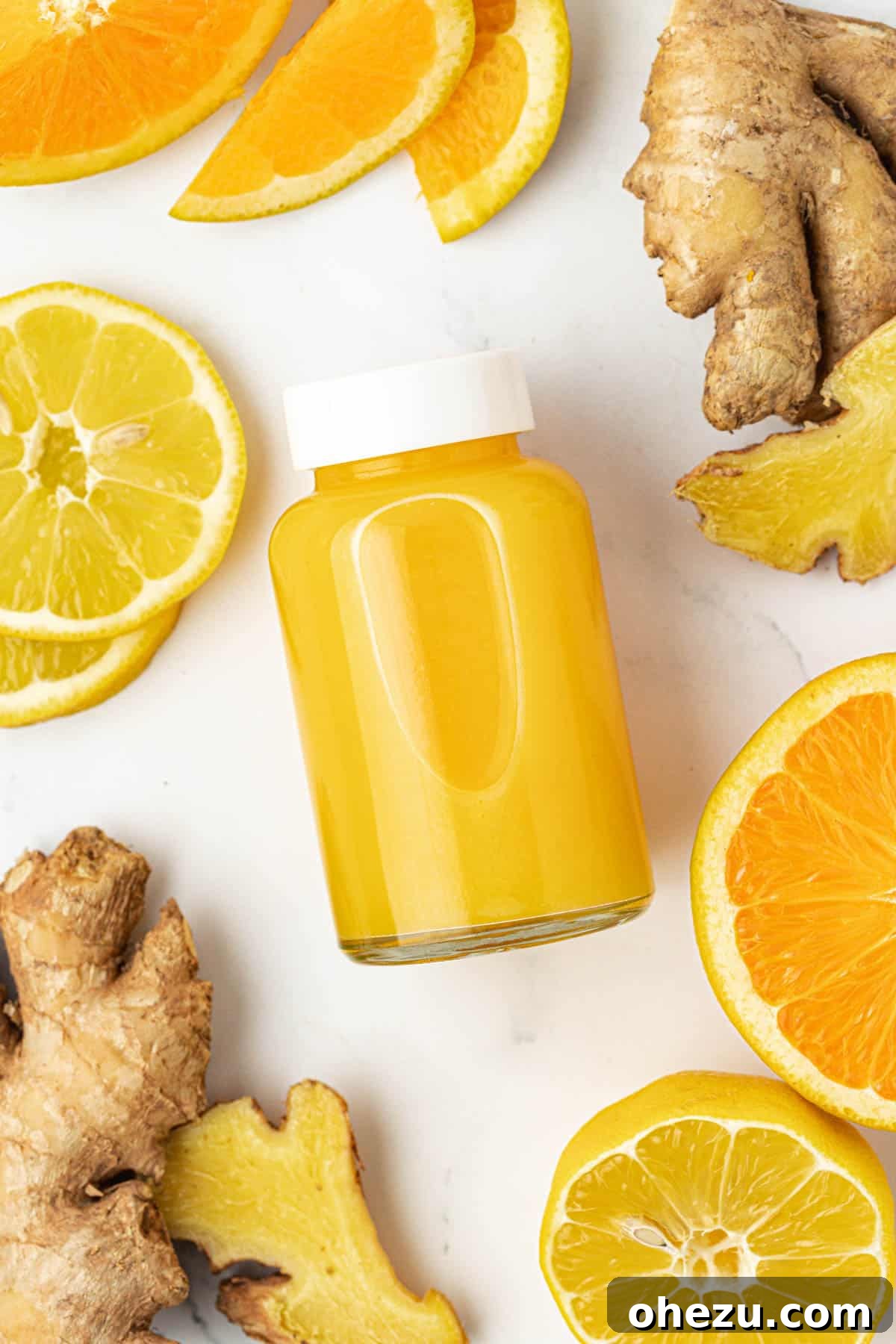 Close-up of fresh oranges, lemons, and ginger, key ingredients for immunity shots.