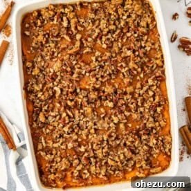Sweet potato casserole with pecans in a baking dish
