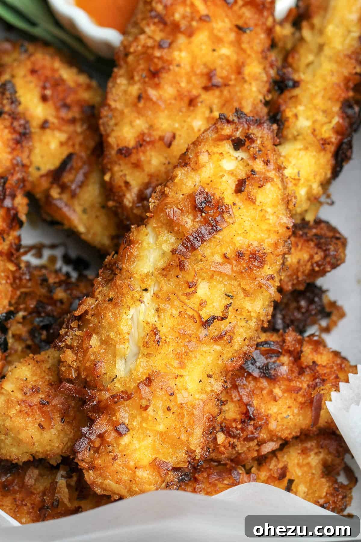 Spicy Coconut Chicken Tenders close up on a board
