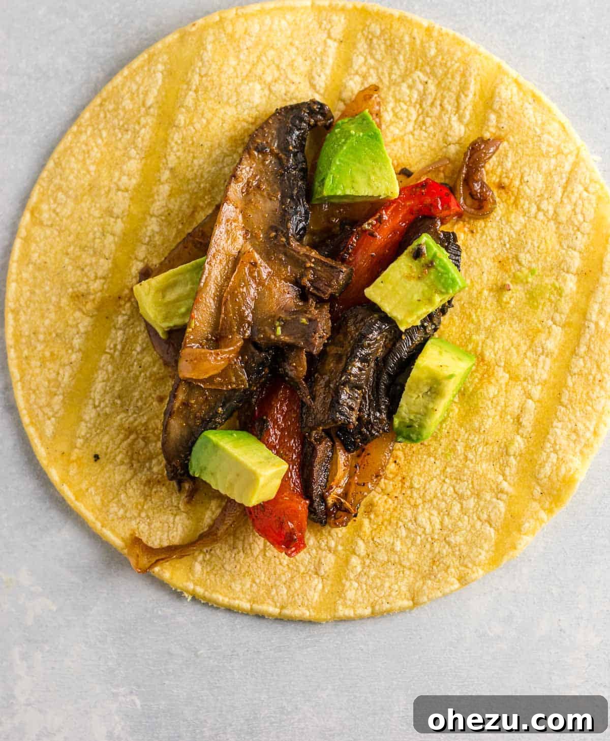 Sizzling Portobello Fajitas 7 A large platter filled with beautifully roasted portobello mushroom fajitas, ready to be served family-style