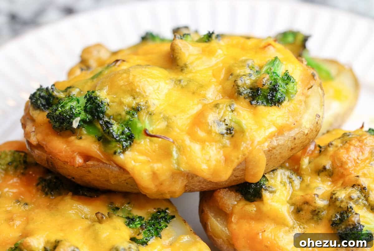 Irresistible Broccoli Cheddar Twice Baked Potatoes 3 Close-up of fluffy, cheesy broccoli and cheddar filling inside a potato skin