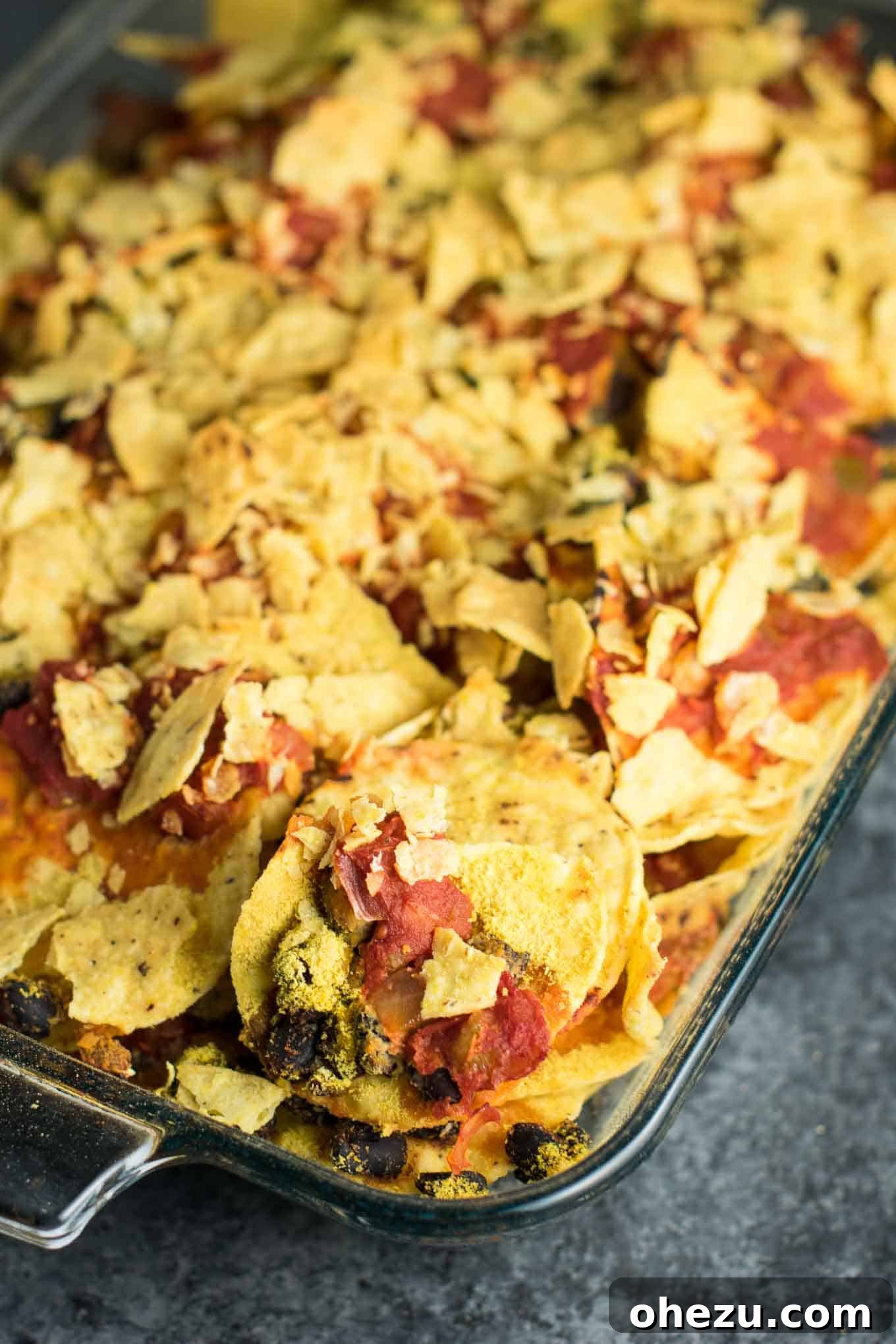 Easy Vegan Taco Bake Recipes - a simple and satisfying plant-based dinner solution for busy weeknights. Featuring black beans, salsa, and nutritional yeast, this casserole is quick to prepare and bakes to perfection.