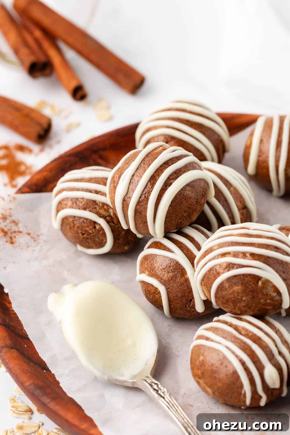 cinnamon roll energy bites arranged artfully on a plate