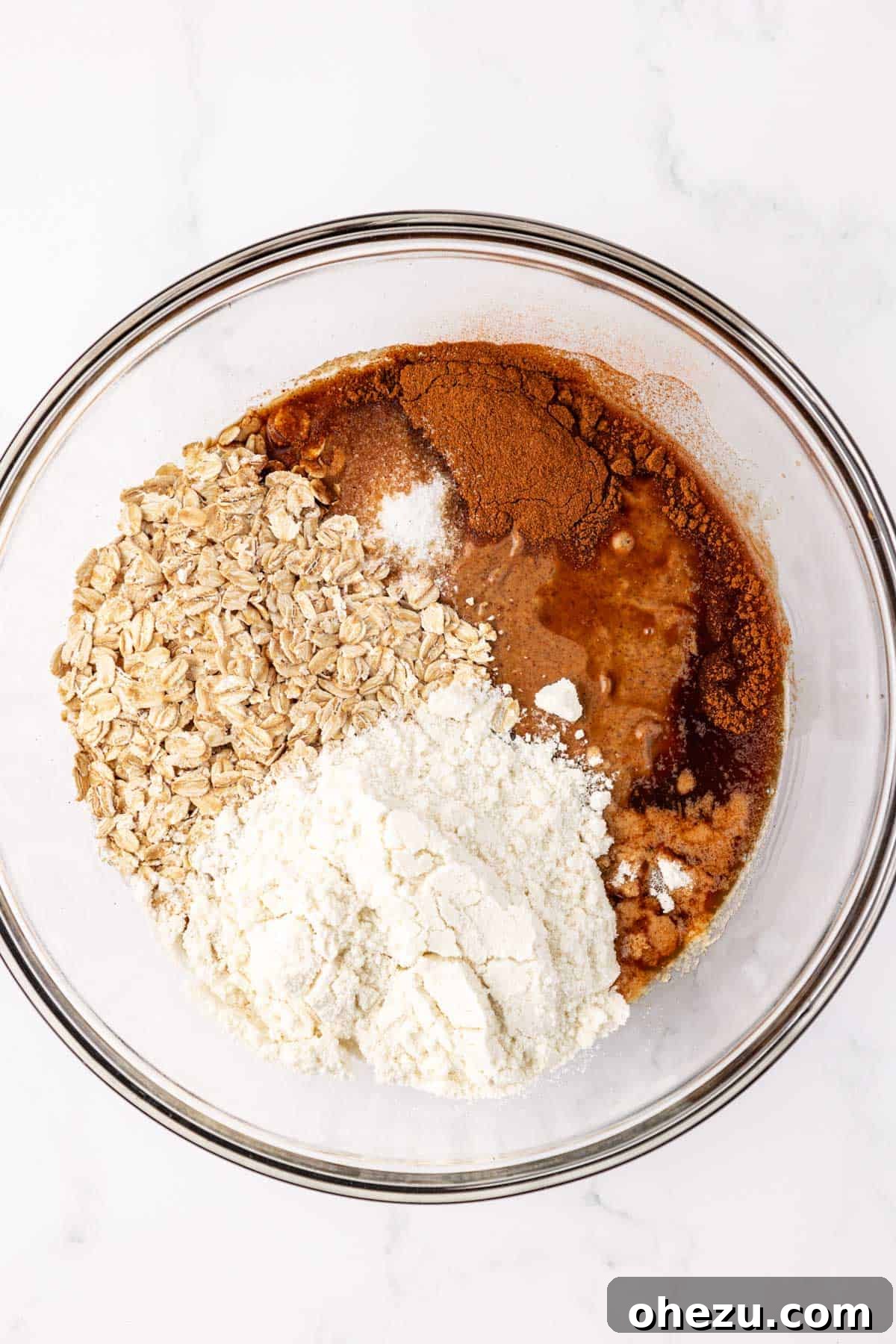 energy bite batter in a glass bowl after initial mixing