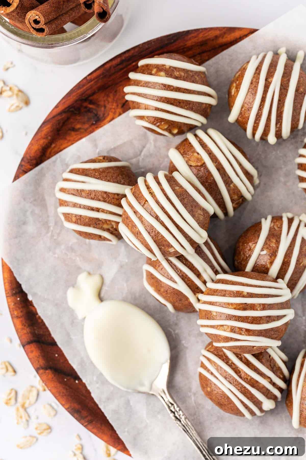 cinnamon roll energy bites on a rustic wooden board