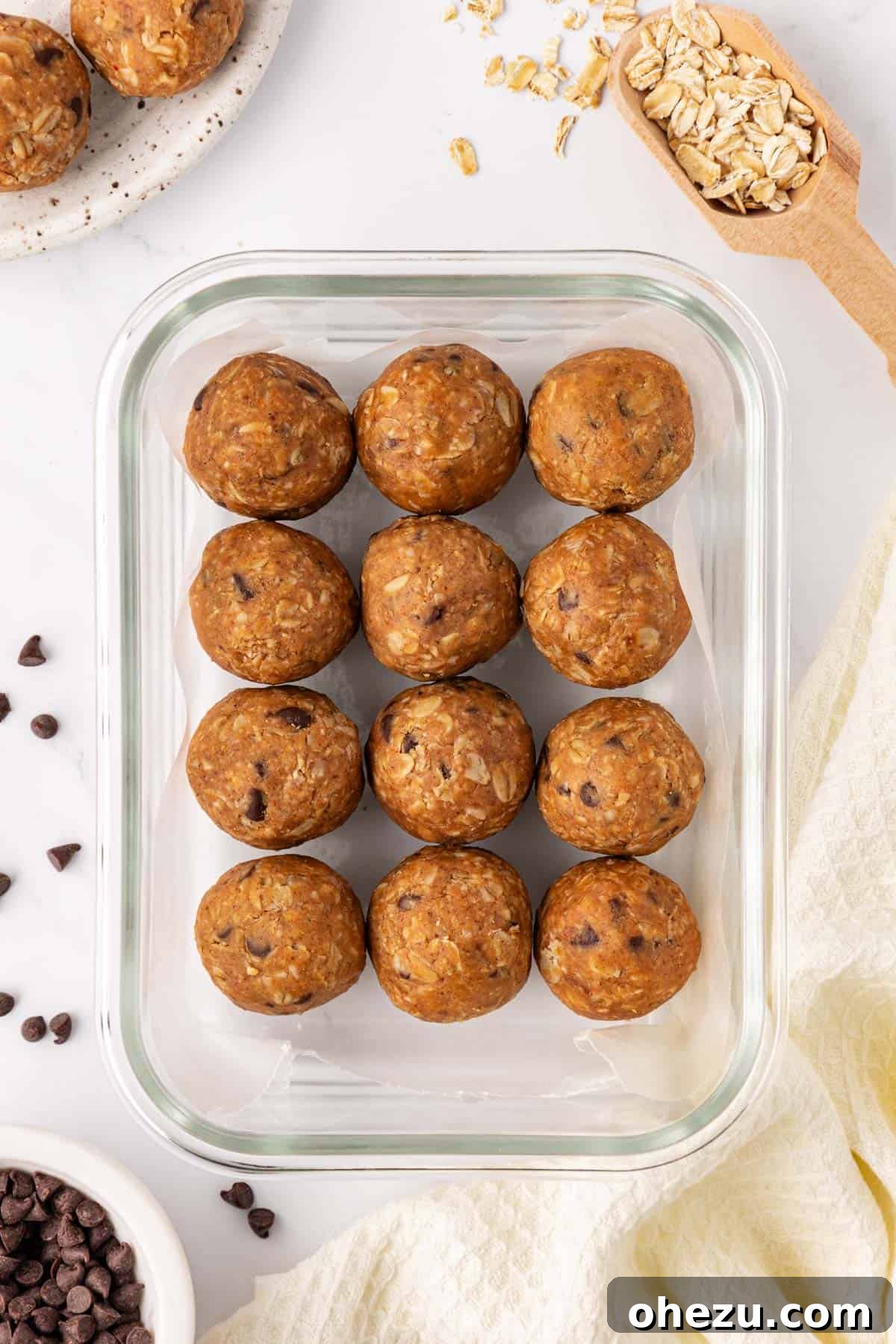 A stack of oatmeal cookie energy balls, highlighting their portability and ideal size for snacking.