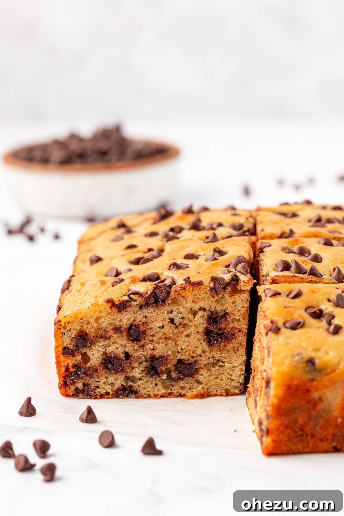 Tangy Greek Yogurt Treat Cake 21 Several slices of Greek Yogurt Snack Cake stacked on a serving plate