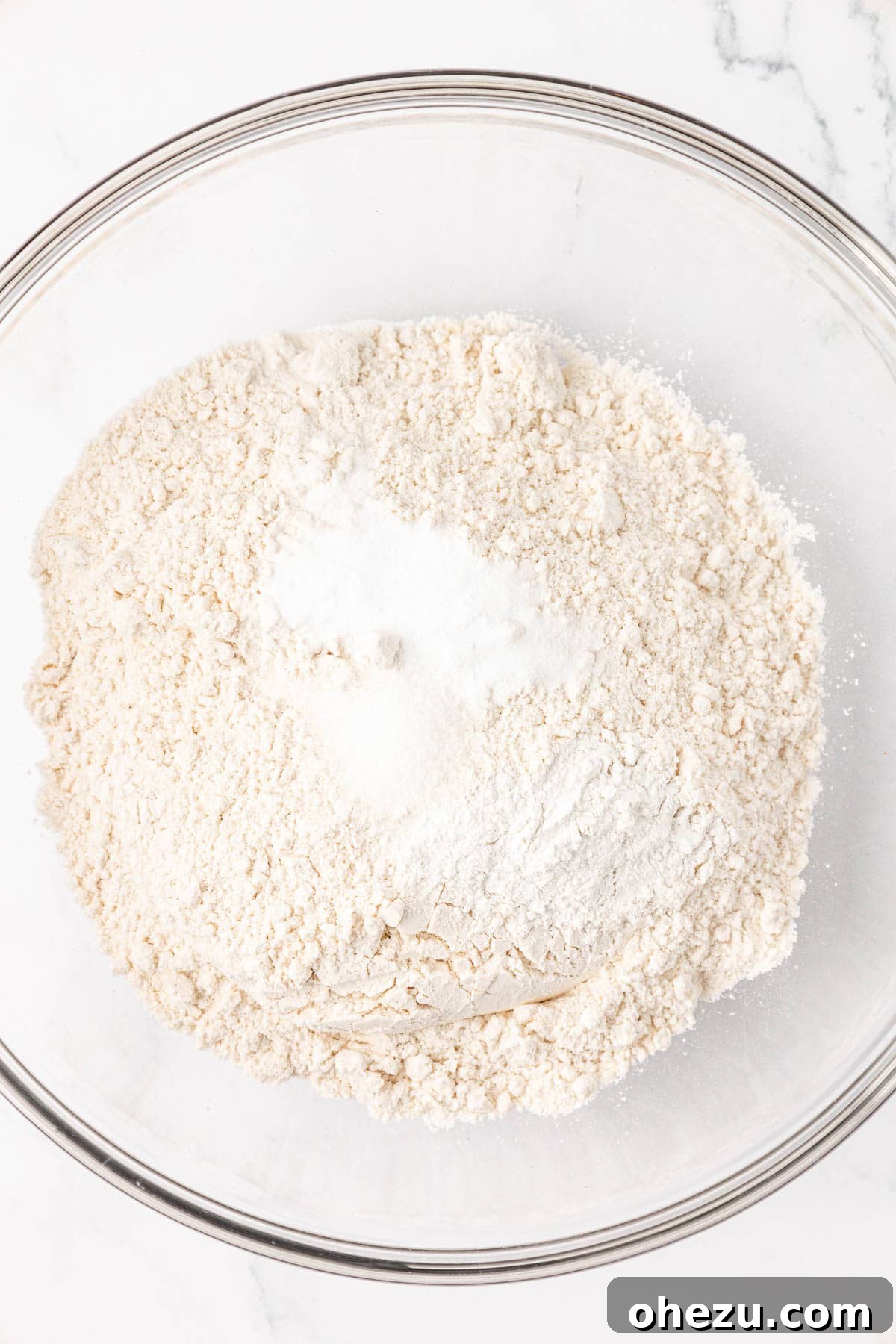 Tangy Greek Yogurt Treat Cake 5 Dry ingredients (flour, salt, baking soda, baking powder) measured out in a mixing bowl