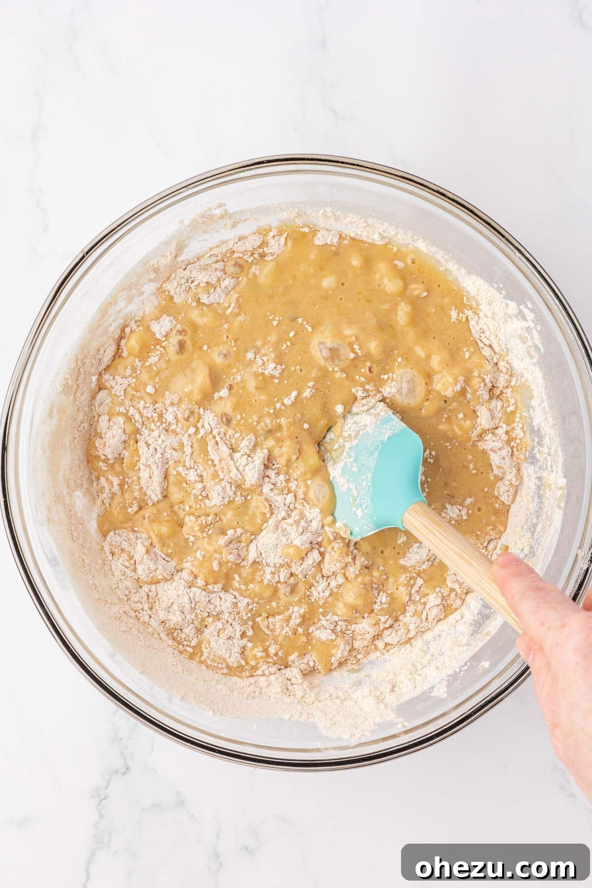 folding the dry ingredients into the wet ingredients