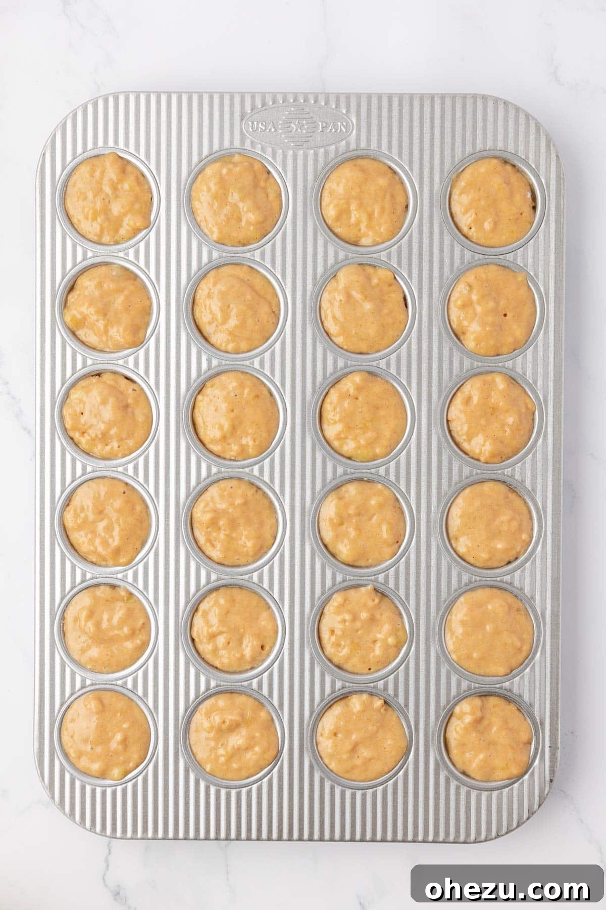 mini muffin tin filled with batter