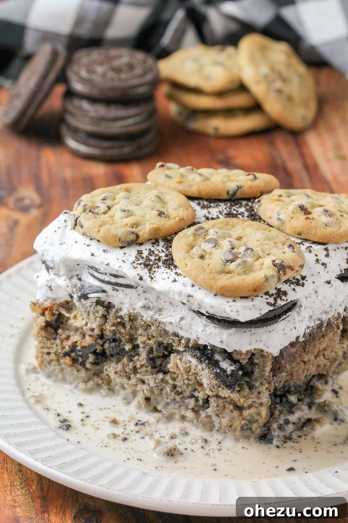 A slice of Cookies & Cream Tres Leches Cake, rich and moist.