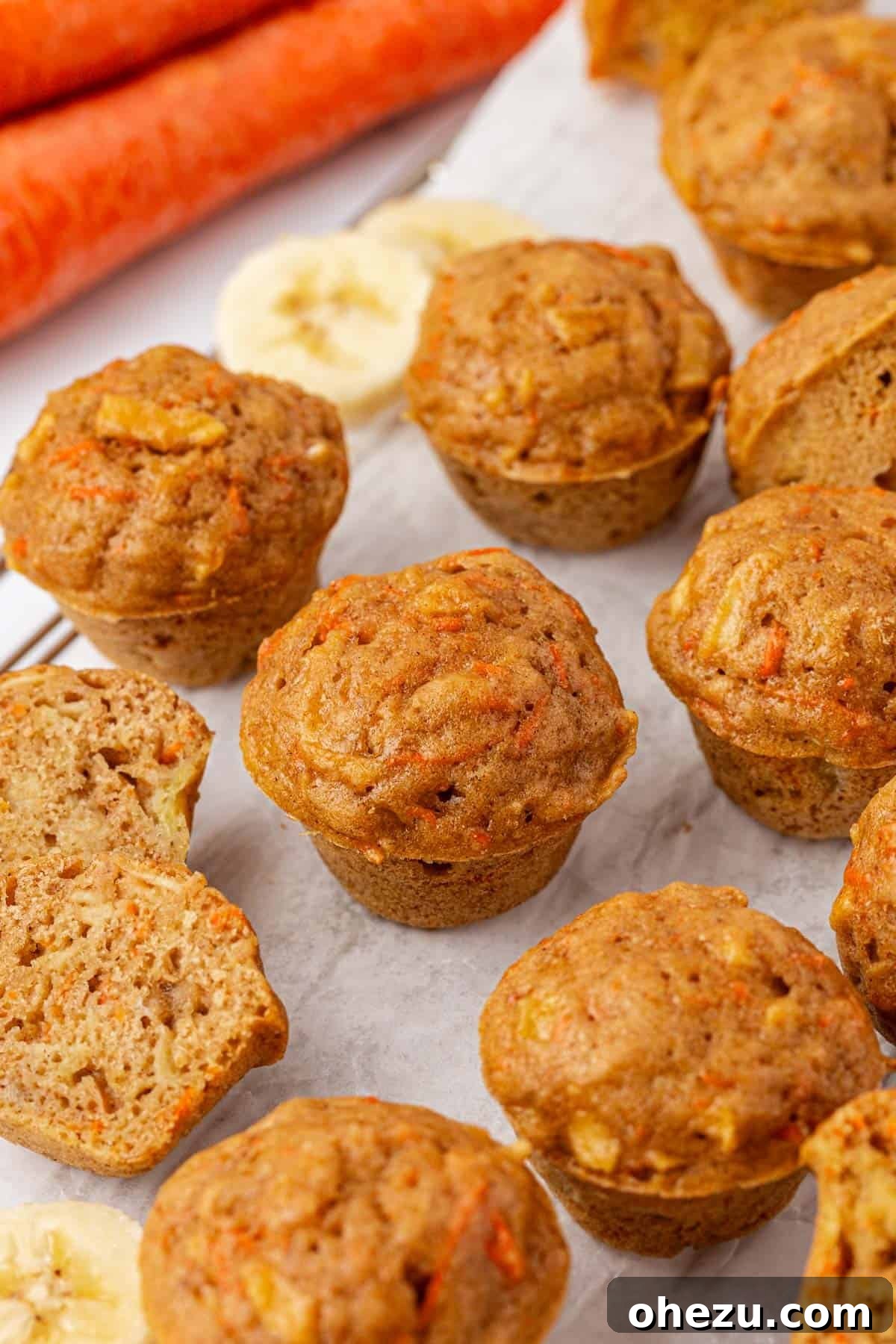 Poppable Perfection Muffins 19 A full batch of freshly baked ABC mini muffins arranged aesthetically on a wooden surface.