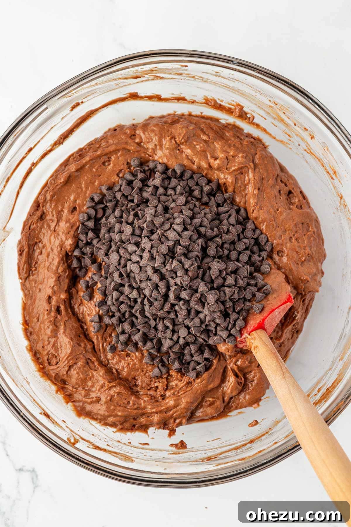 Adding mini chocolate chips to the chocolate cake batter