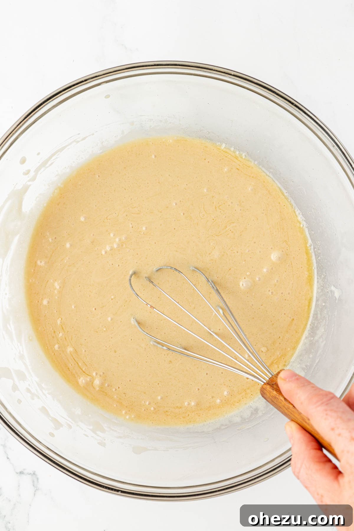 Whisking the wet ingredients together for the cake batter