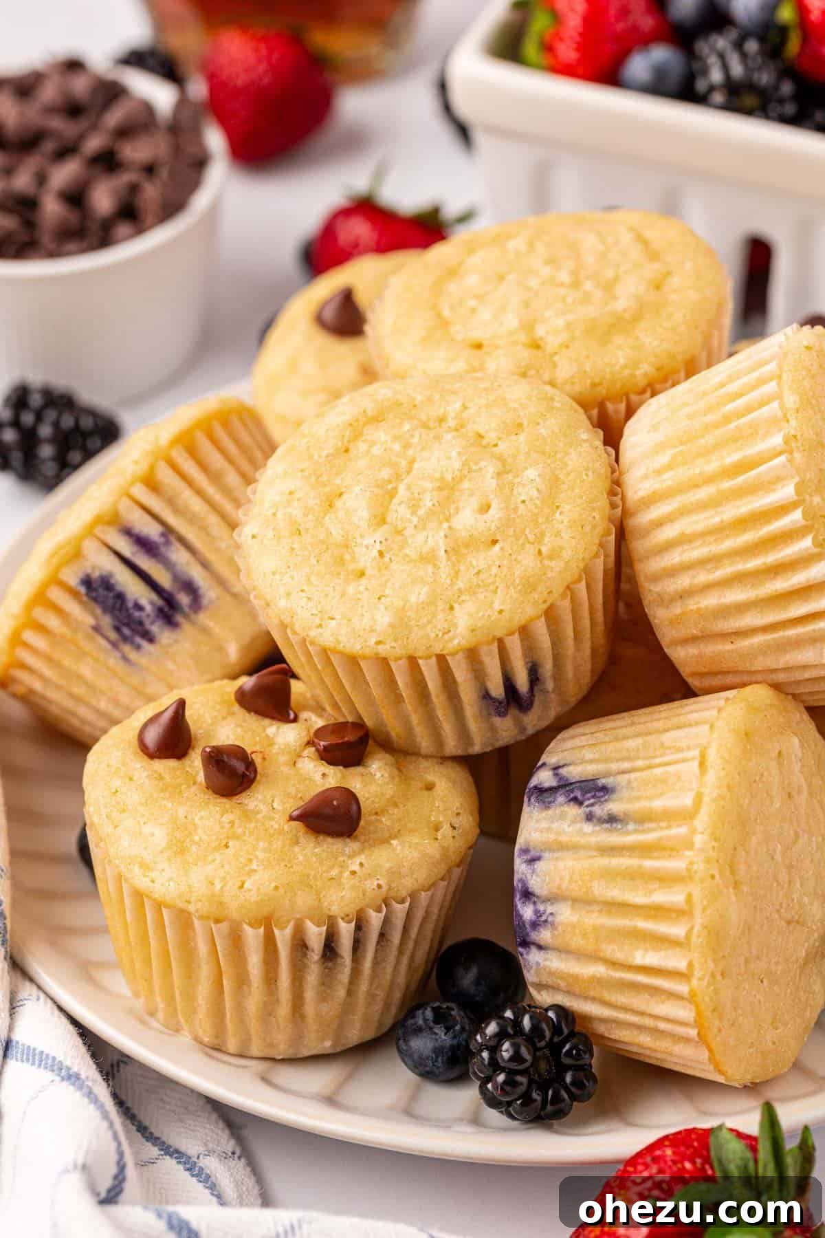 Freshly baked pancake muffins in a muffin tin, golden brown and puffed, straight out of the oven.