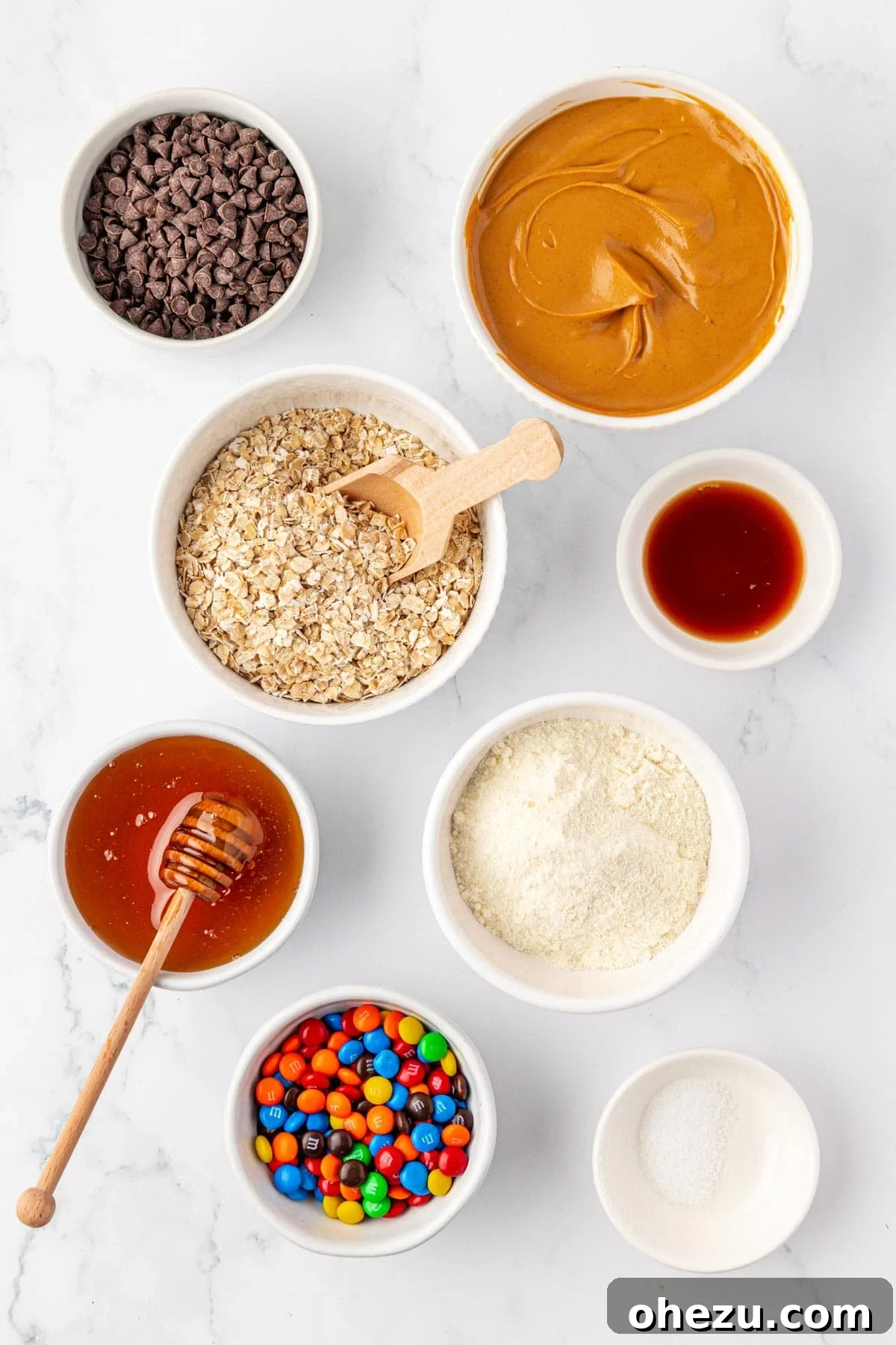 All ingredients laid out on a table for making monster cookie protein bars