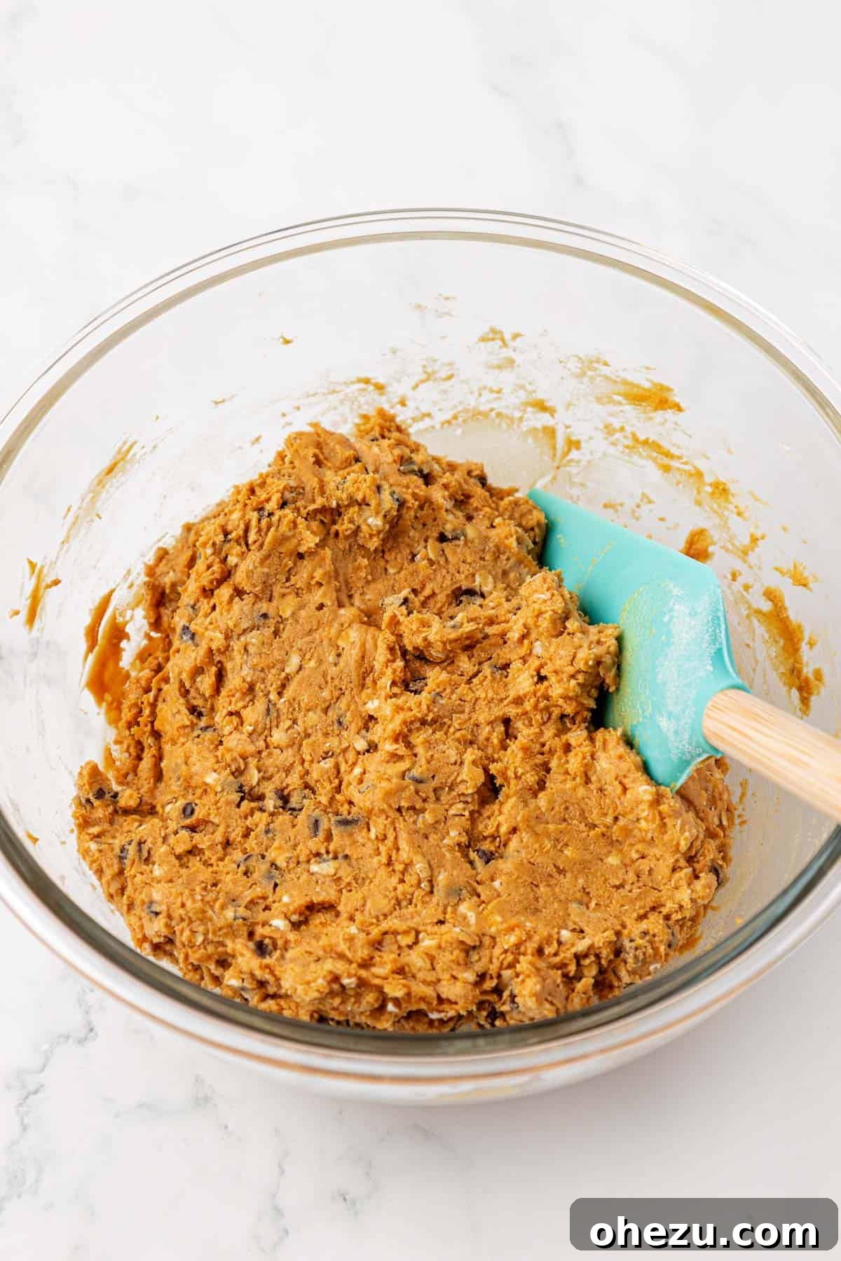 Well-mixed protein bar batter in a bowl, showing thick consistency