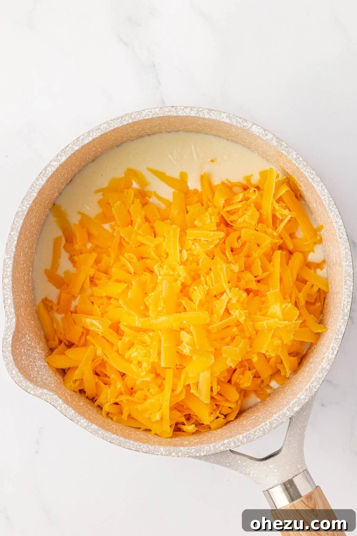 adding the cheese to the roux