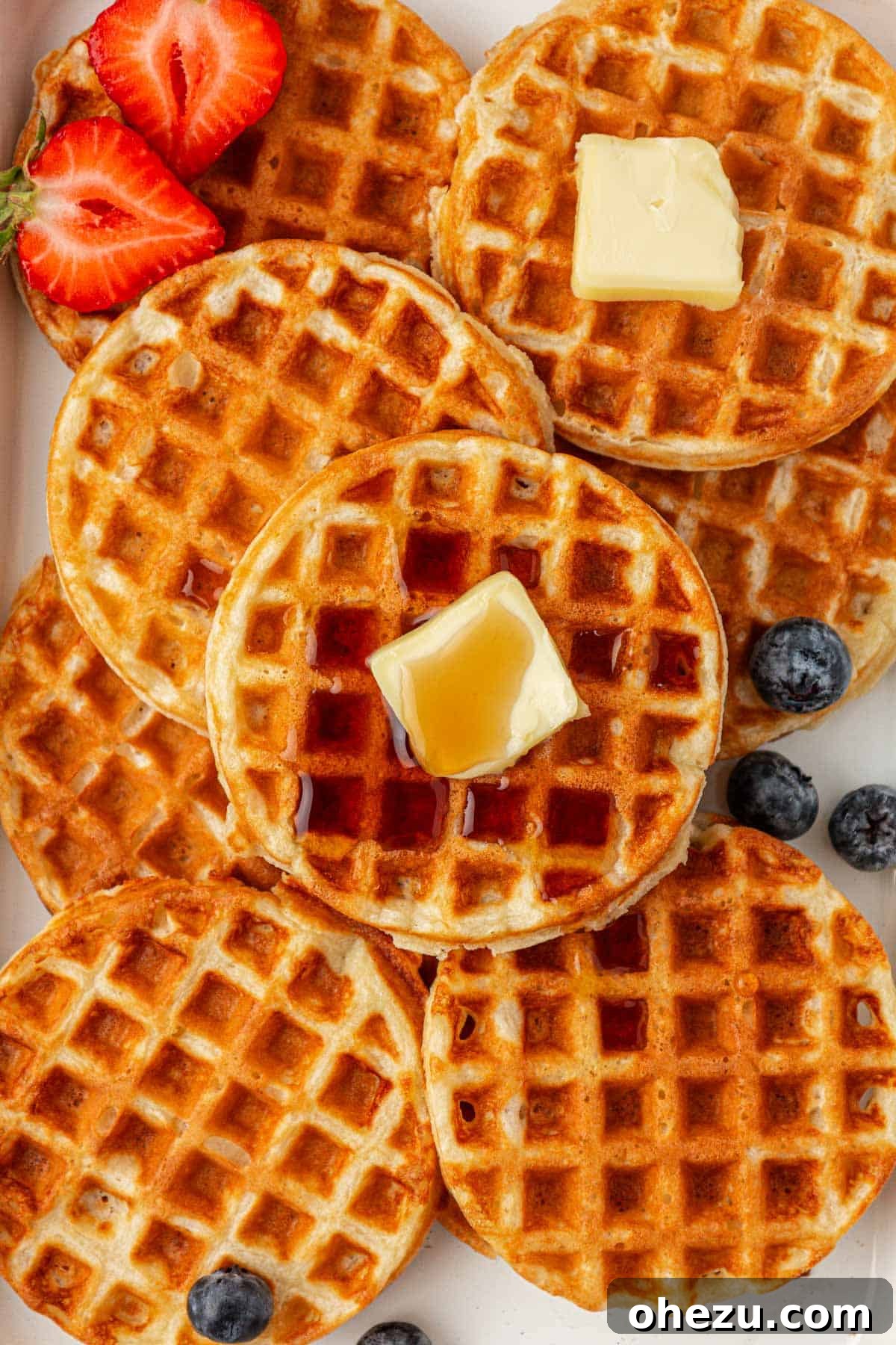 Protein-Packed Greek Yogurt Waffles 2 Golden brown Greek yogurt waffles stacked and ready to eat