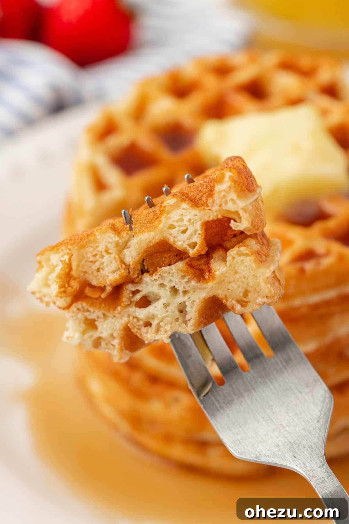 Protein-Packed Greek Yogurt Waffles 19 A fork holding a piece of Greek yogurt waffle, showing its fluffy interior