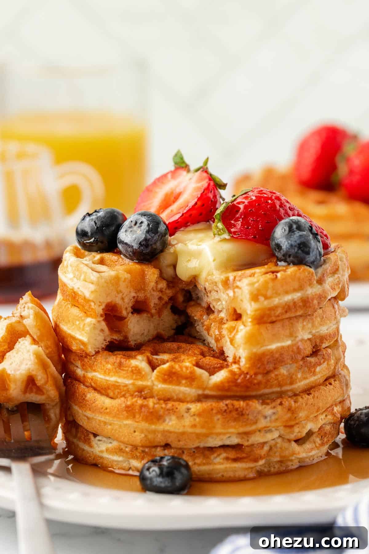 Protein-Packed Greek Yogurt Waffles 3 Delicious Greek yogurt waffles topped with fresh fruit, maple syrup, and a pat of butter