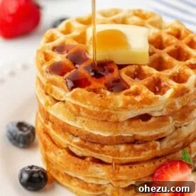 A close-up of a perfectly golden Greek Yogurt Waffle