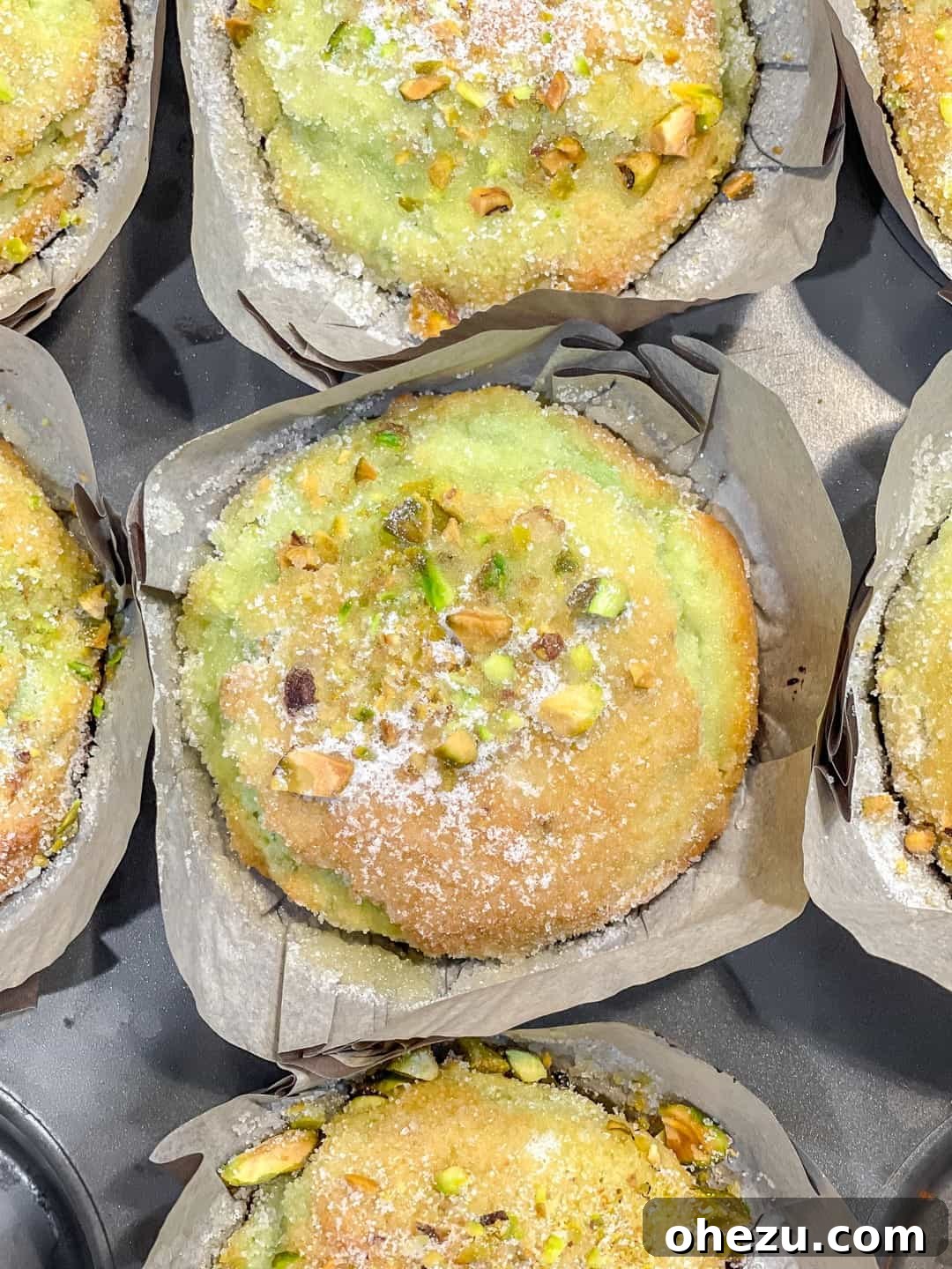 Easy Bakery-Style Pistachio Muffins with a perfect dome and crunchy top