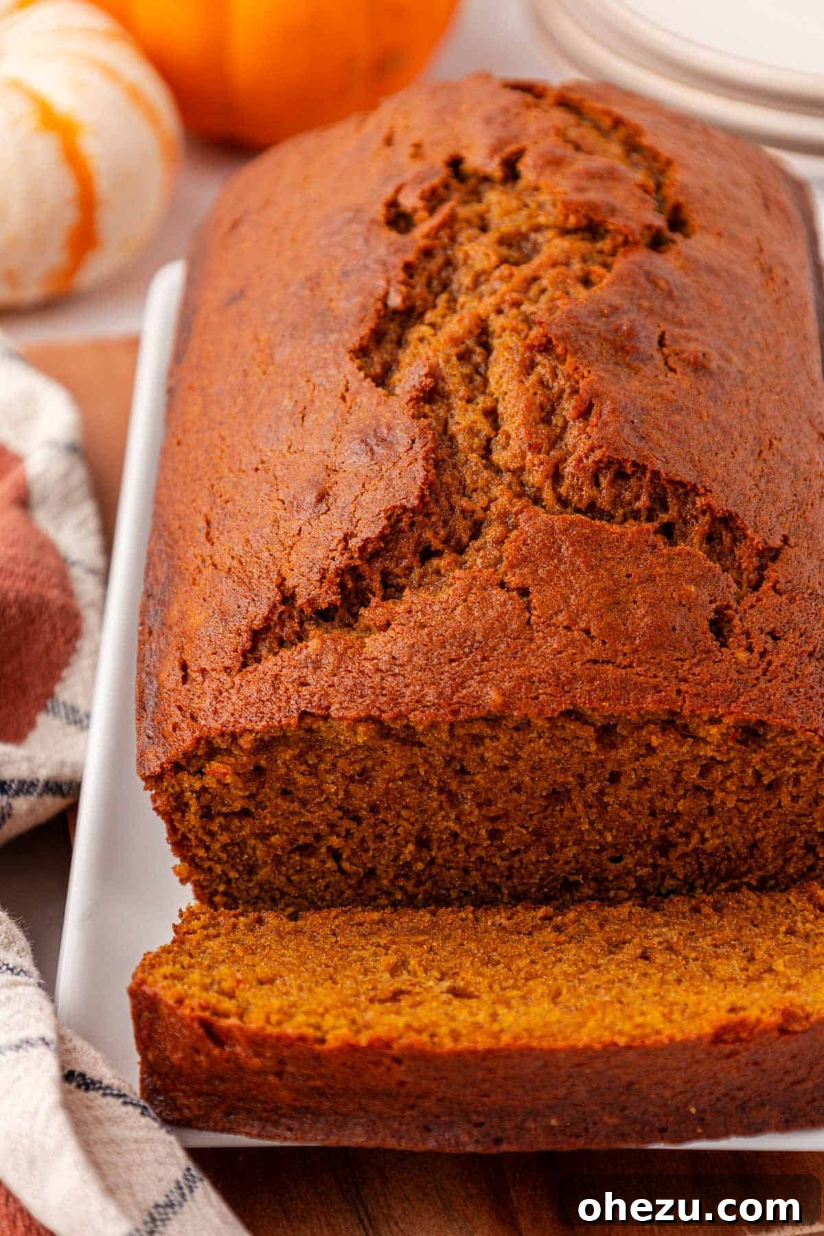 a cooled pumpkin bread loaf placed on a wire rack, ready for slicing