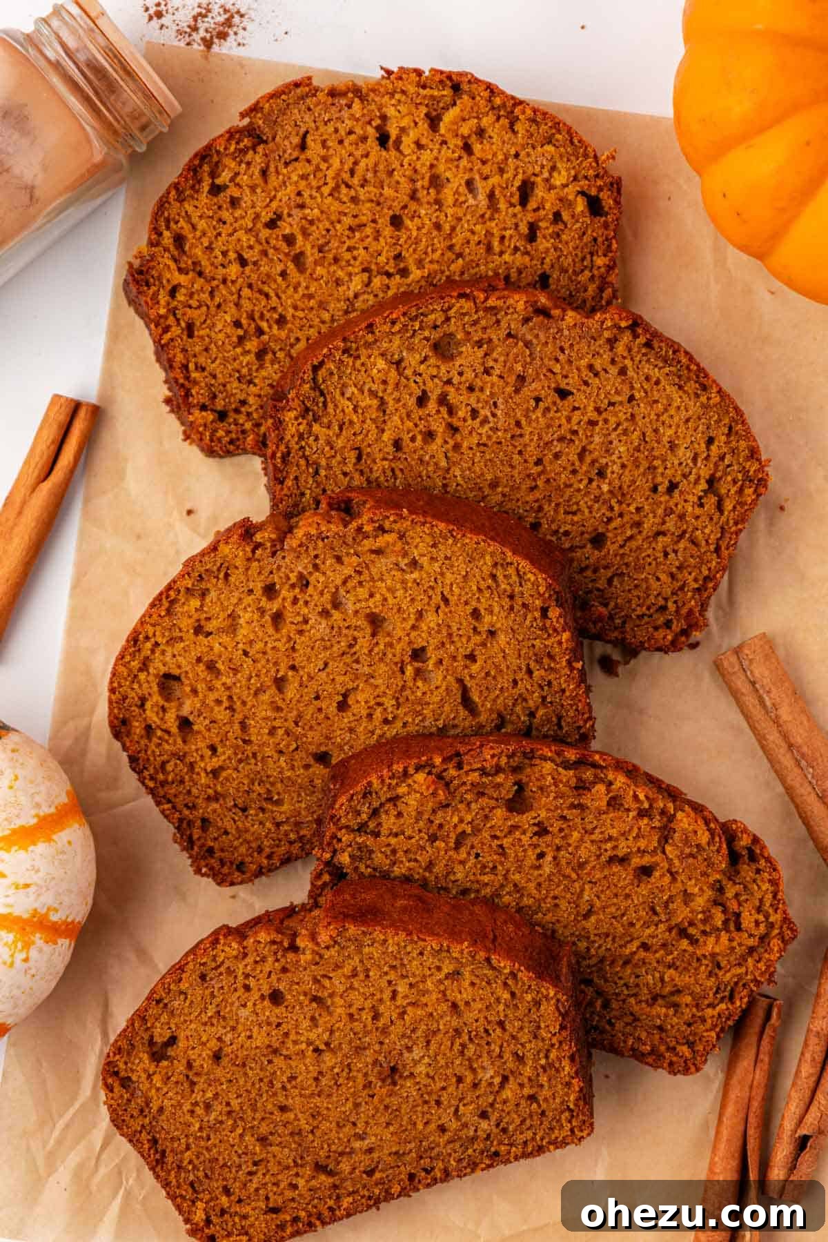 multiple slices of pumpkin bread arranged appealingly on a serving platter