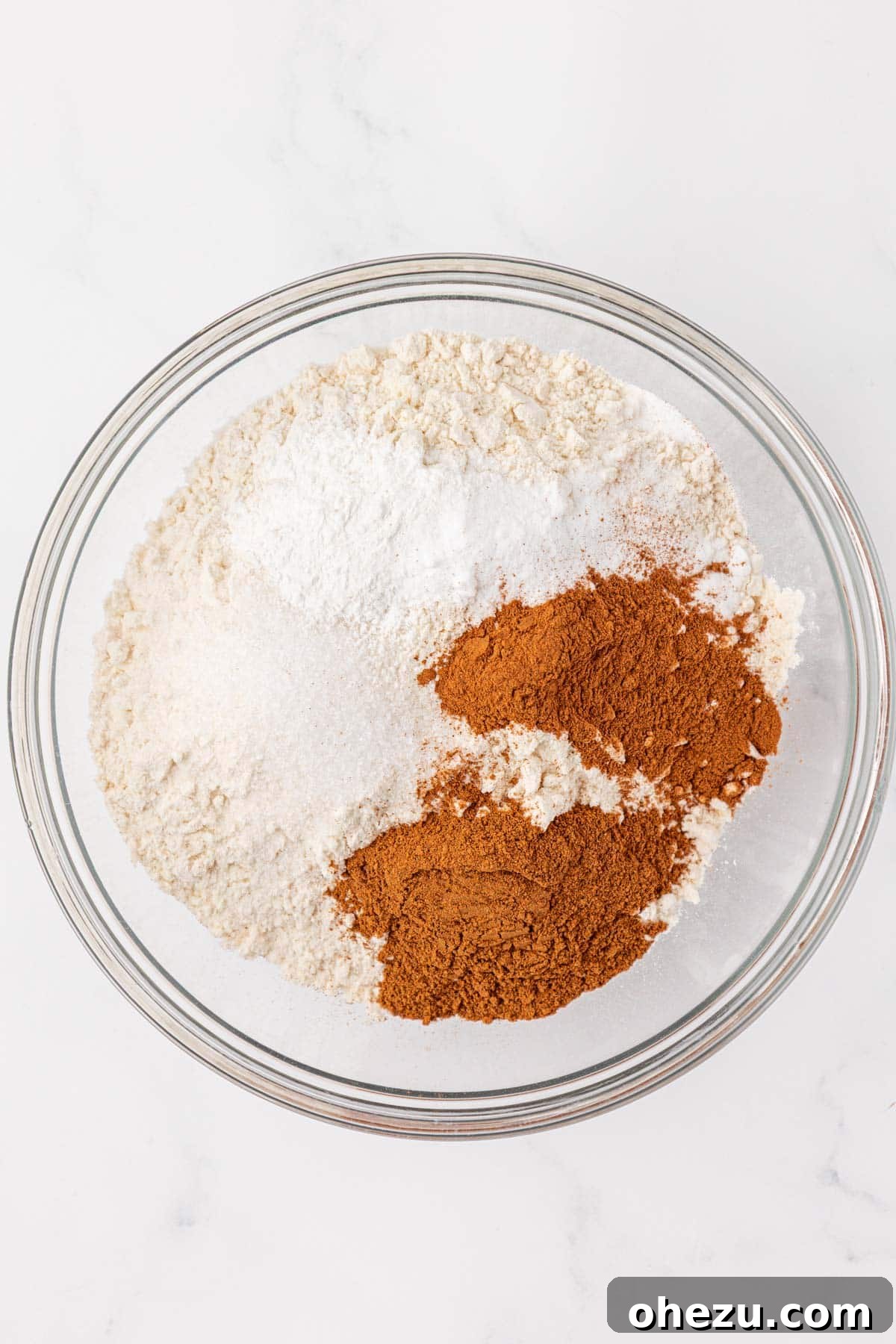 dry ingredients for pumpkin bread measured into a mixing bowl
