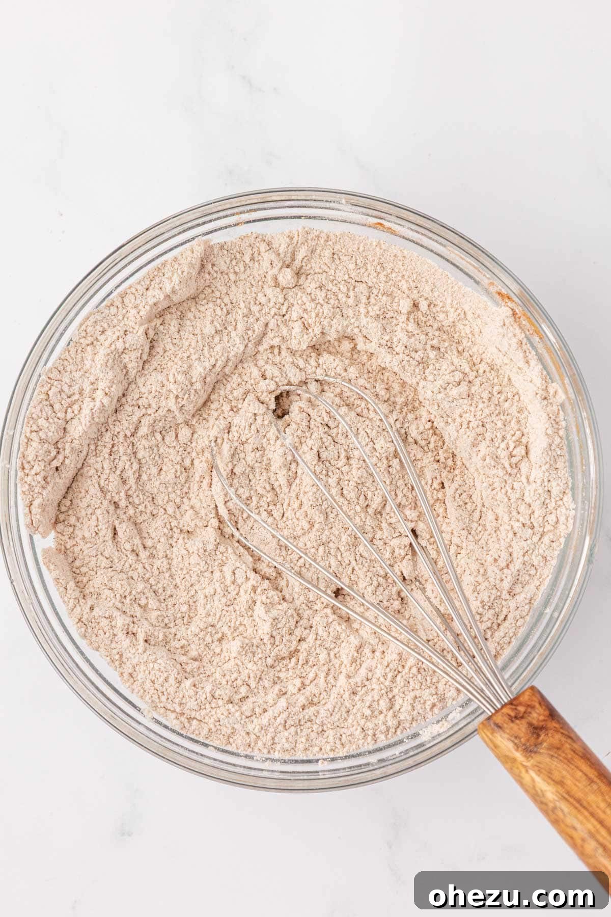 dry ingredients whisked together in a bowl, creating a uniform mixture