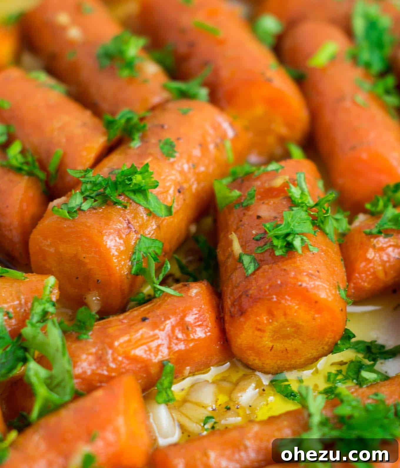 Perfectly roasted carrots infused with garlic butter, showcasing their tender texture and golden-brown edges.