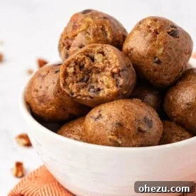 Elegant pecan pie energy bites, featuring chopped pecans and a rich, sweet filling