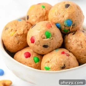 Colorful M&M Cashew Crunch Energy Bites, showcasing vibrant candies and crunchy cashews