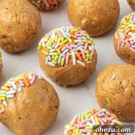 Festive birthday cake protein balls, adorned with colorful sprinkles