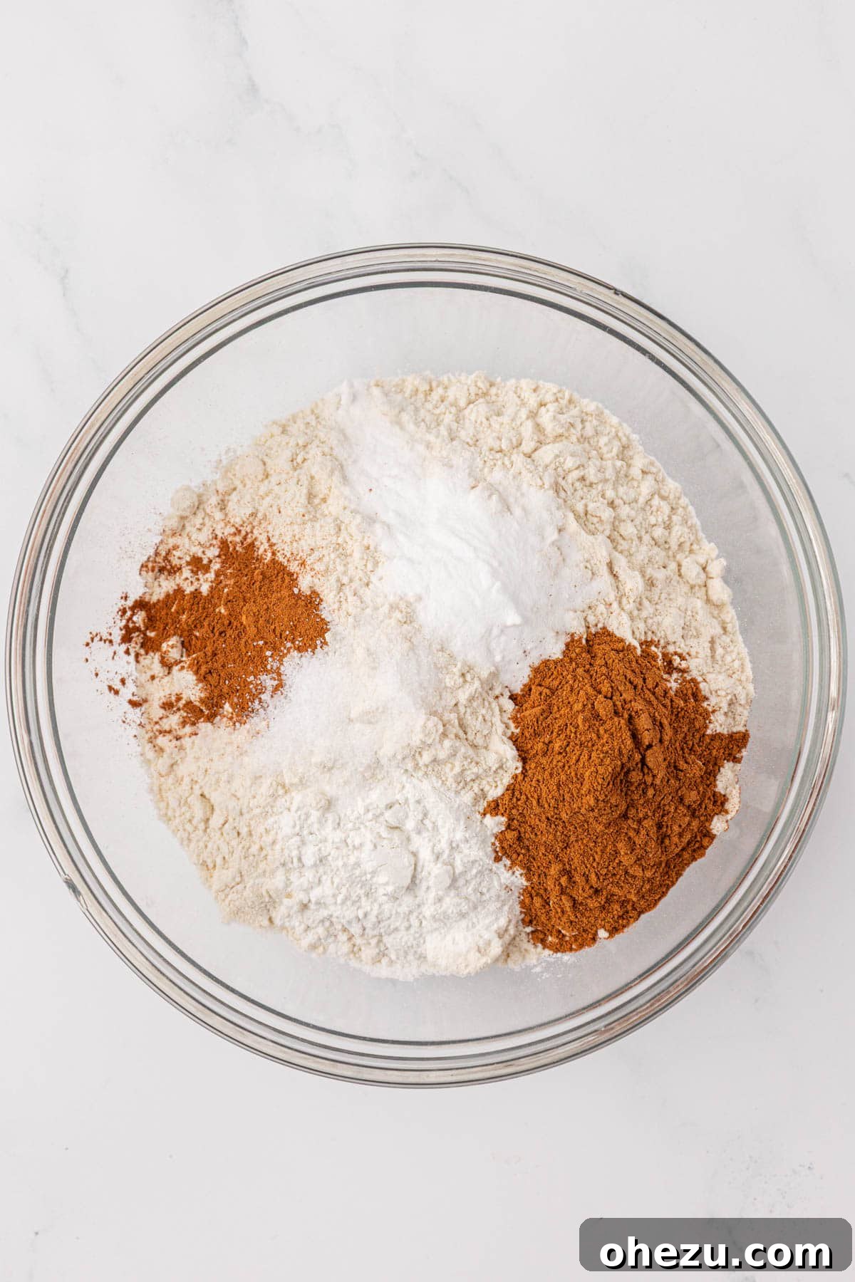 Dry ingredients for pumpkin cake in a mixing bowl, prior to whisking