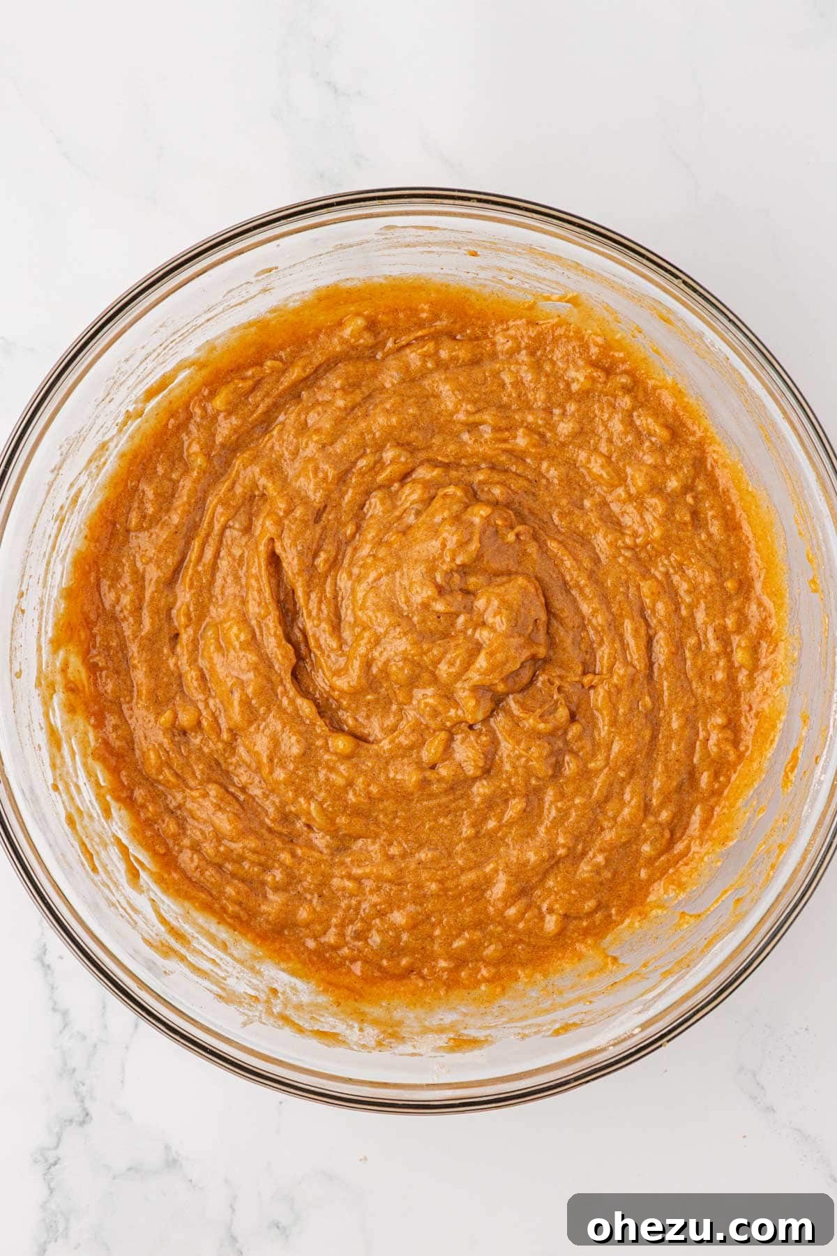 Pumpkin banana muffin batter gently mixed until just combined