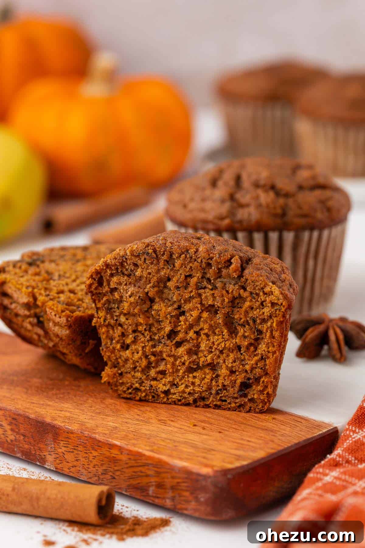 Close-up of baked pumpkin banana muffins on a cooling rack