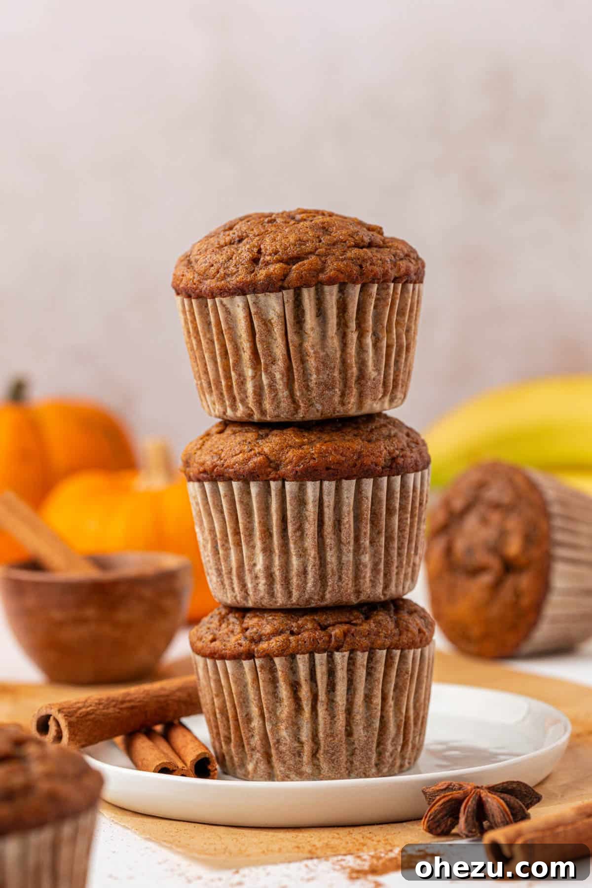 Stack of moist and fluffy pumpkin banana muffins ready to eat
