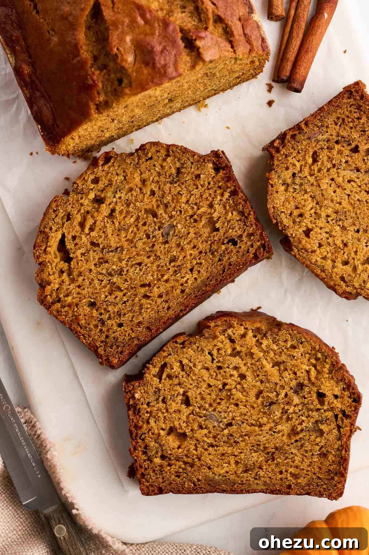 Close-up of freshly baked pumpkin banana bread slices, showing moist texture and inviting crumb