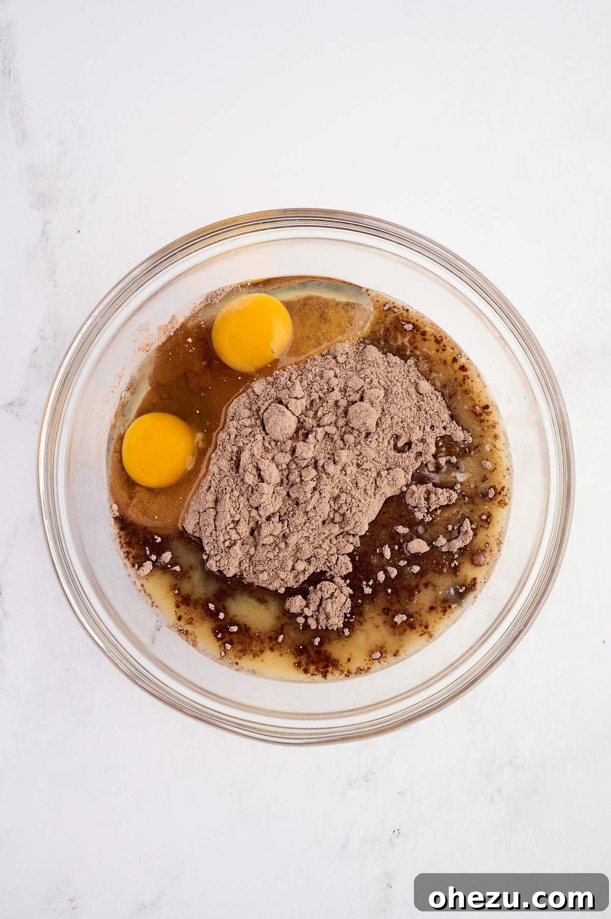 eggs, melted butter, and cake mix in a mixing bowl before mixing